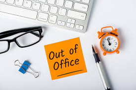 Out of office notice on a desk